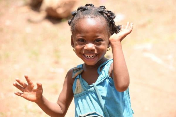 Young girl waving
